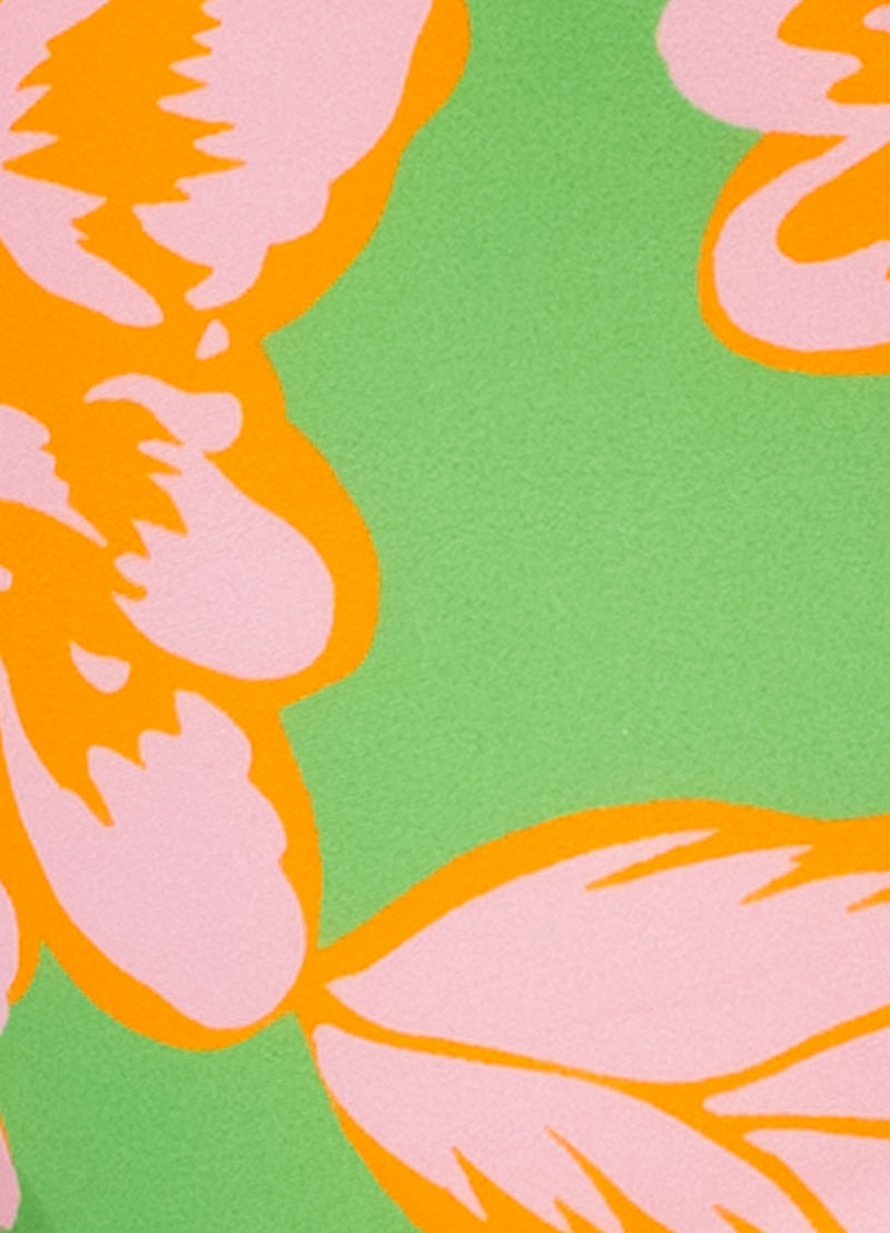Floral pattern with pink and orange flowers on a green background.