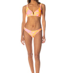 Woman wearing a colorful bikini set on a white background.