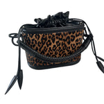 Leopard print bag with black accents on a white background.