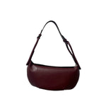 Brown leather handbag on a white background.