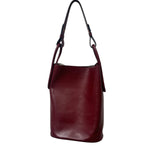 Maroon leather handbag on a white background.