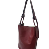 Brown leather handbag on a white background.