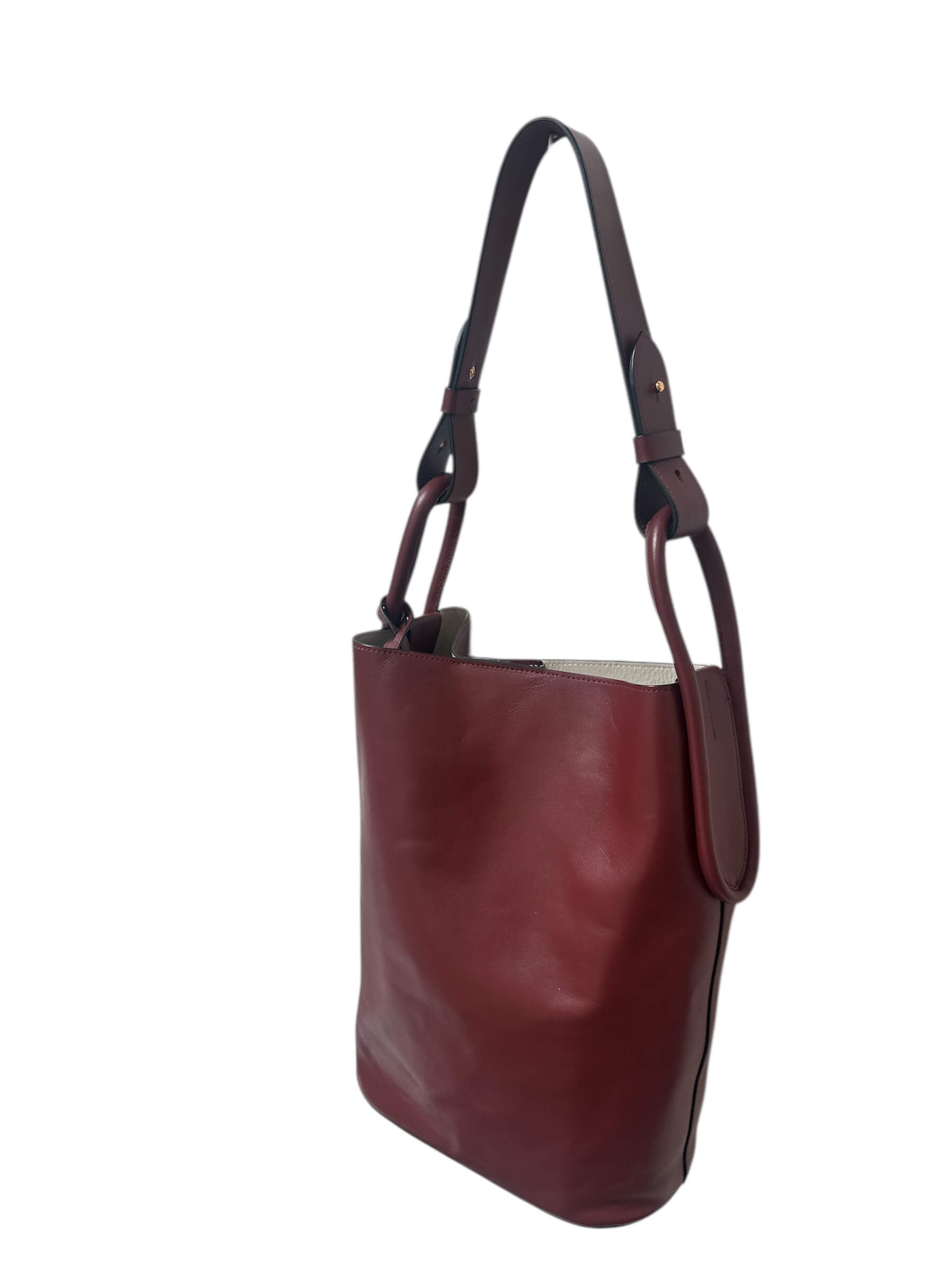 Brown leather handbag on a white background.