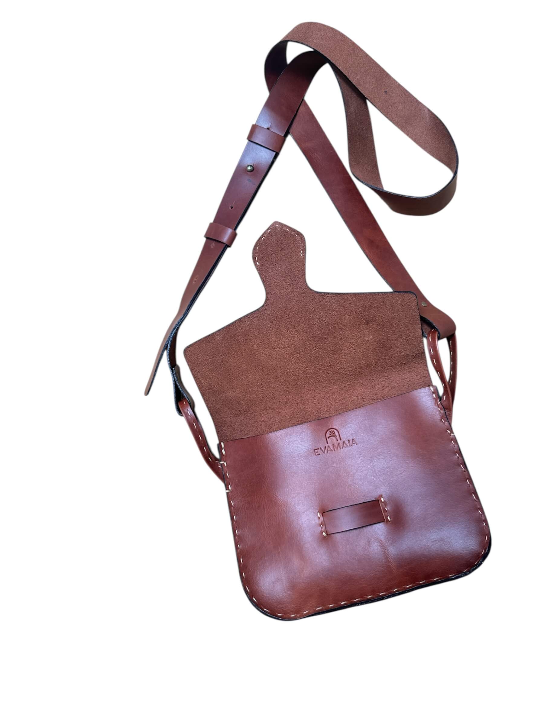 Brown leather crossbody bag with a strap on a white background.