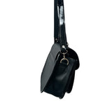 Black carriel crossbody purse with a strap on a white background.