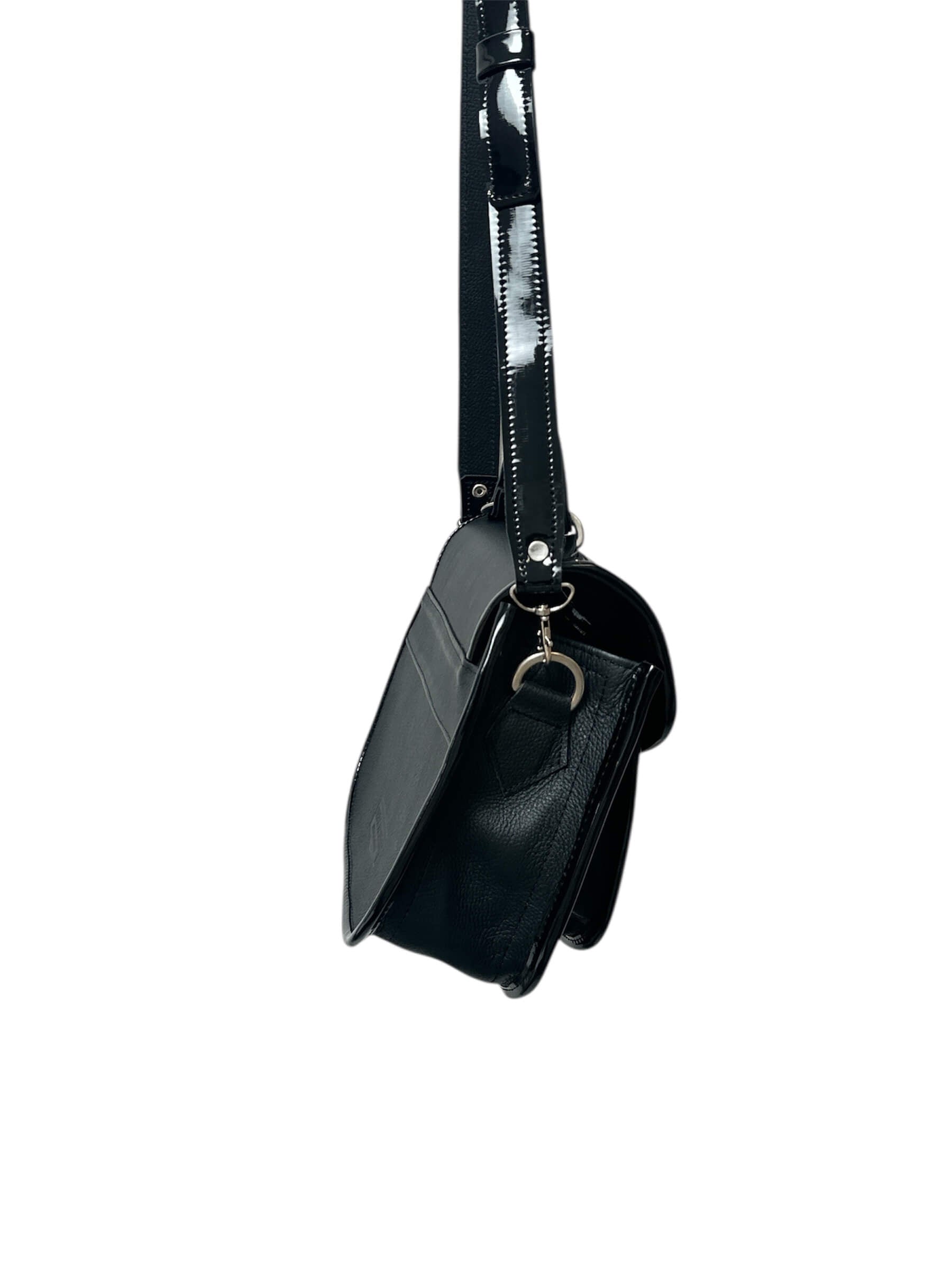 Black carriel crossbody purse with a strap on a white background.