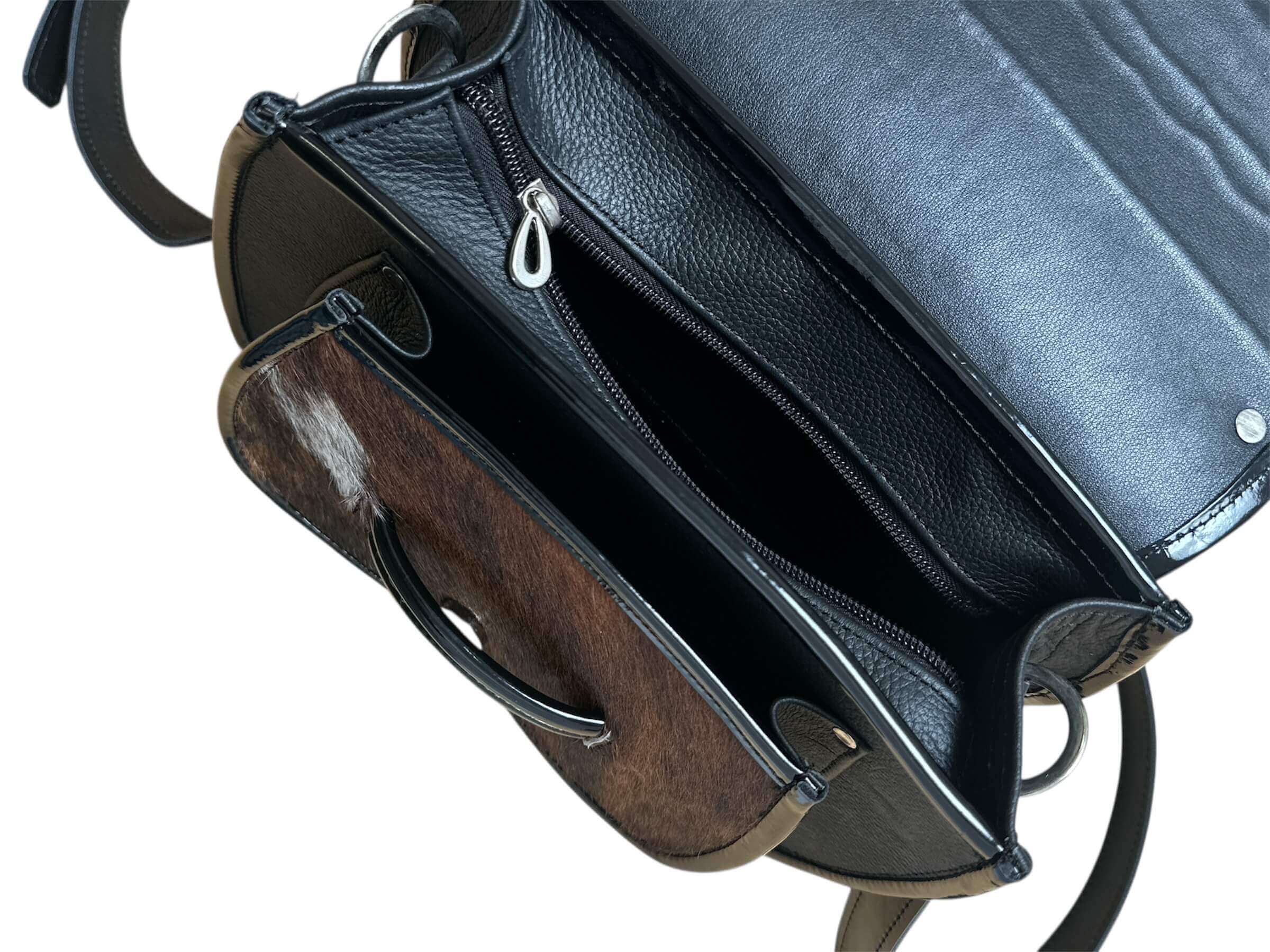 Close-up of a leather crossbody purse.