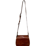 Brown leather crossbody bag on a white background.