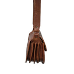 Brown leather bag with strap on a white background