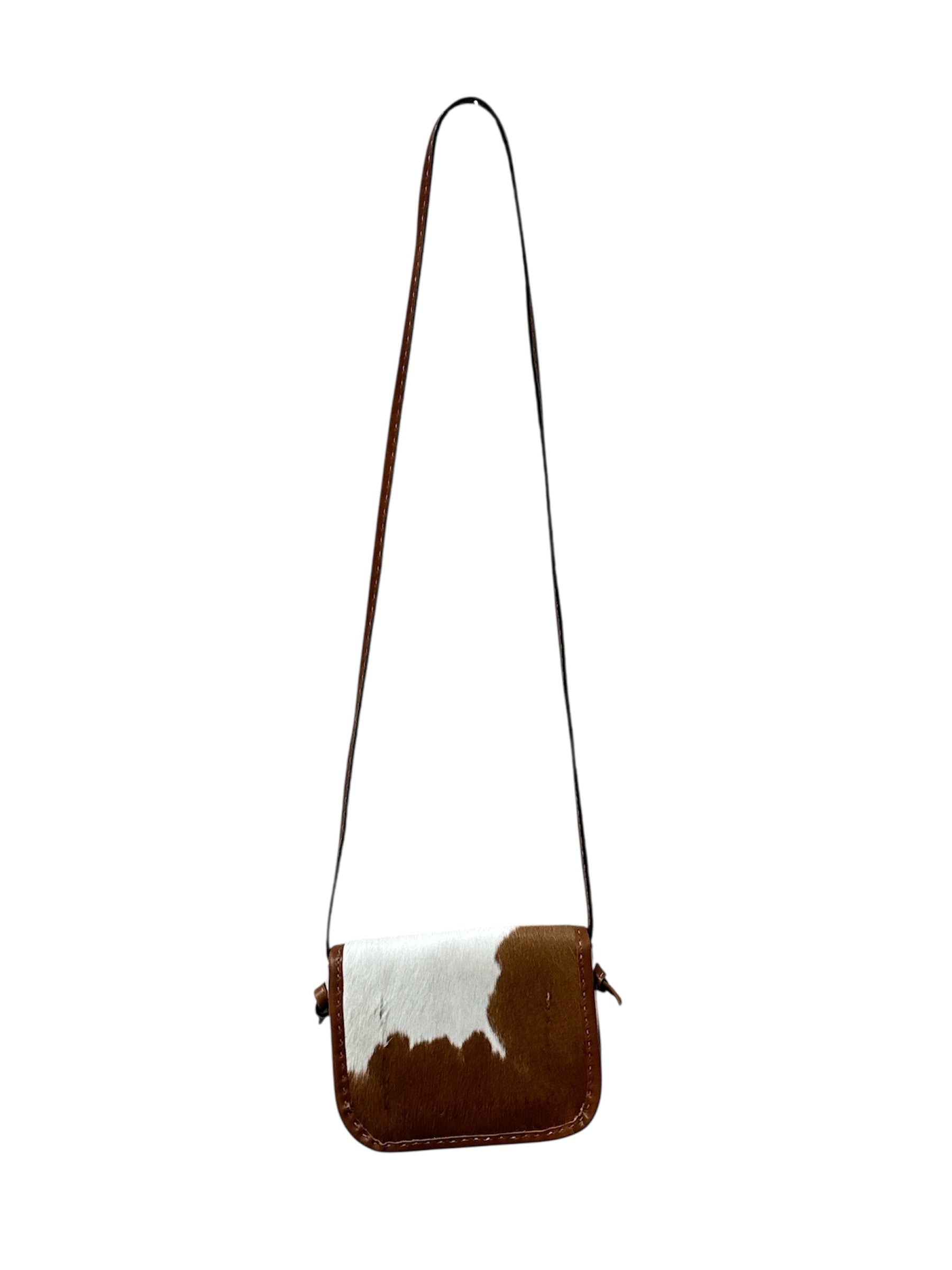 Brown and white cowhide crossbody bag on a white background.