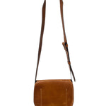 Close-up of a brown leather bag with visible stitching on a white background.