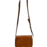 Close-up of a brown leather bag with visible stitching on a white background.