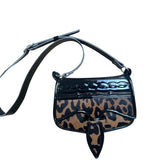 Animal print leather carriel crossbody purse. 