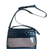 Black carriel crossbody purse with a strap and cow hide material on a white background.