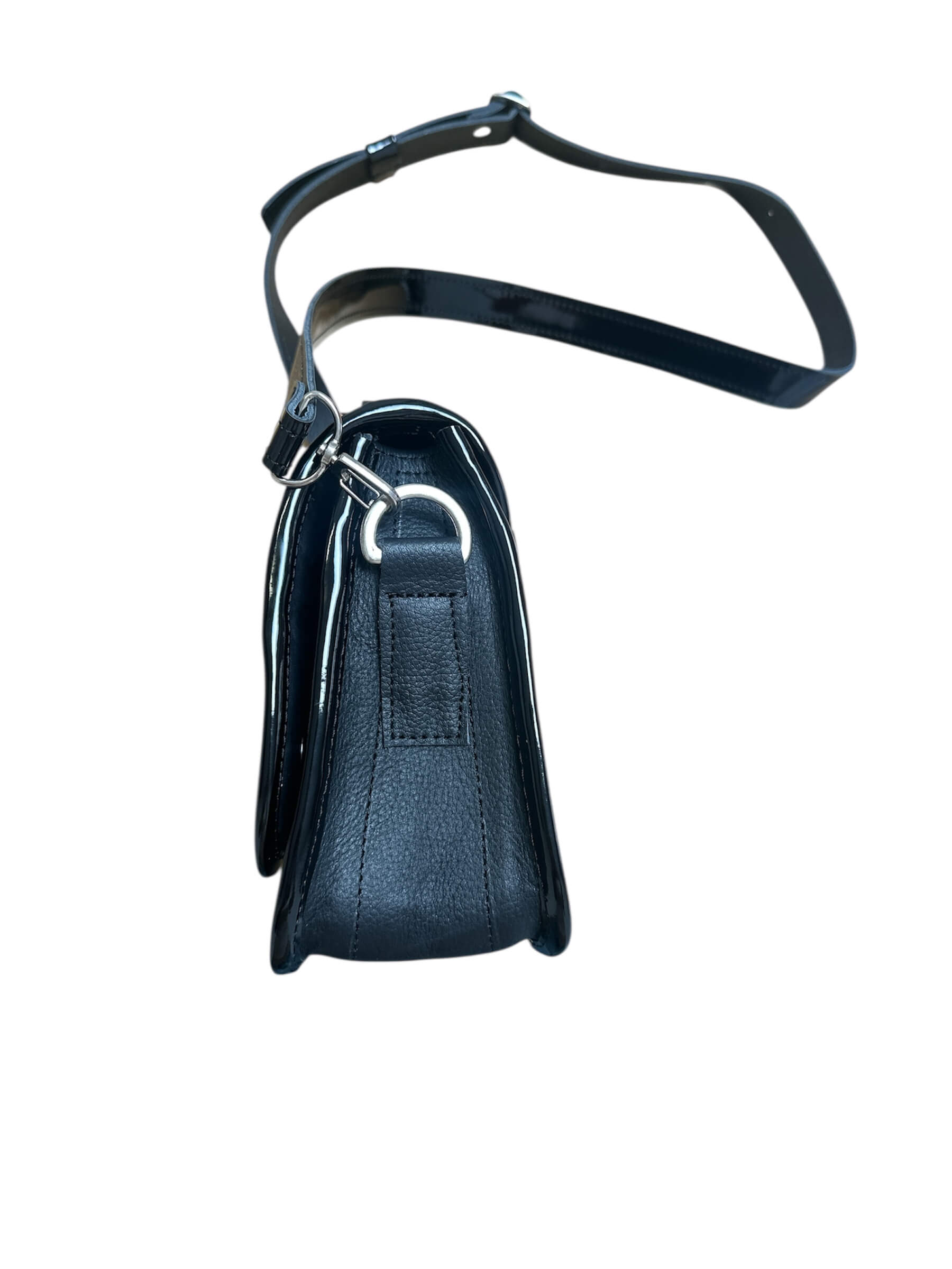 Brown and black leather crossbody carriel bag with decorative elements on a white background.
