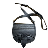 Black leather carriell crossbody bag with decorative patterns on a white background