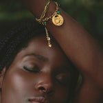 Woman wearing refugio de Sol bracelet set with fossil jade and cat's eye stones. Free US Shipping from Studio City, CA