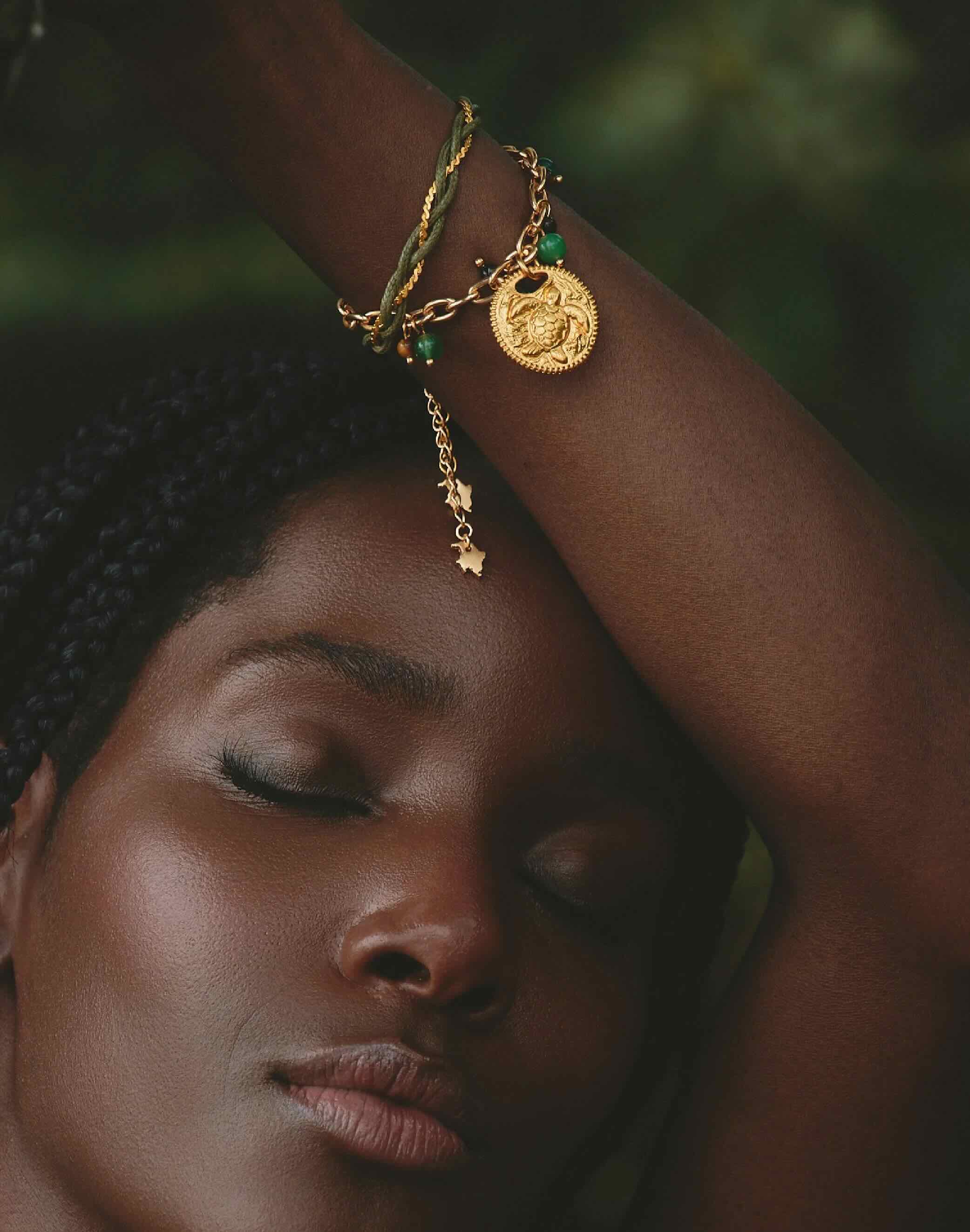 Woman wearing refugio de Sol bracelet set with fossil jade and cat's eye stones. Free US Shipping from Studio City, CA