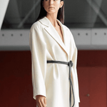 Lady wearing a coat and black tokyo belt