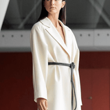 Lady wearing a coat and black tokyo belt