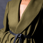 Lady wearing a coat and black tokyo belt