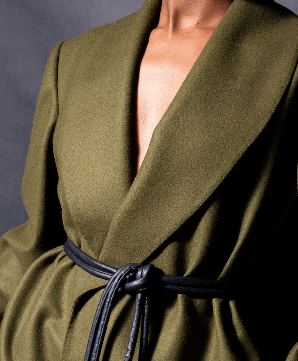 Lady wearing a coat and black tokyo belt