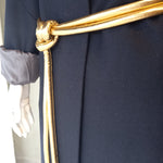 coat and gold tokyo belt