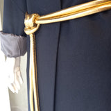 coat and gold tokyo belt