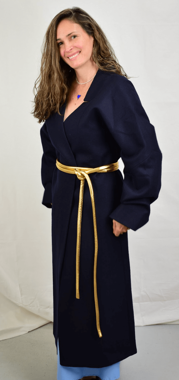 Lady wearing a coat and gold tokyo belt