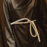 Lady wearing a coat and white tokyo belt