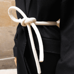 Lady wearing a coat and white tokyo belt