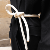 Lady wearing a coat and white tokyo belt