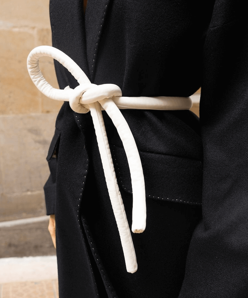 Lady wearing a coat and white tokyo belt