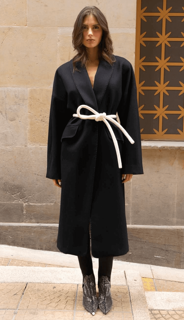 Lady wearing a coat and white tokyo belt