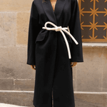 Lady wearing a coat and white tokyo belt