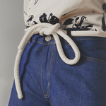 Lady wearing a coat and white tokyo belt