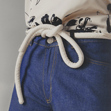 Lady wearing a coat and white tokyo belt