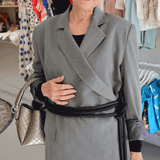 Lady wearing a coat and black tokyo belt