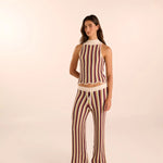 Woman wearing a hand-knit striped set by Vorn. Available at EVAMAIA boutque.