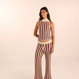 Woman wearing a hand-knit striped set by Vorn. Available at EVAMAIA boutque.