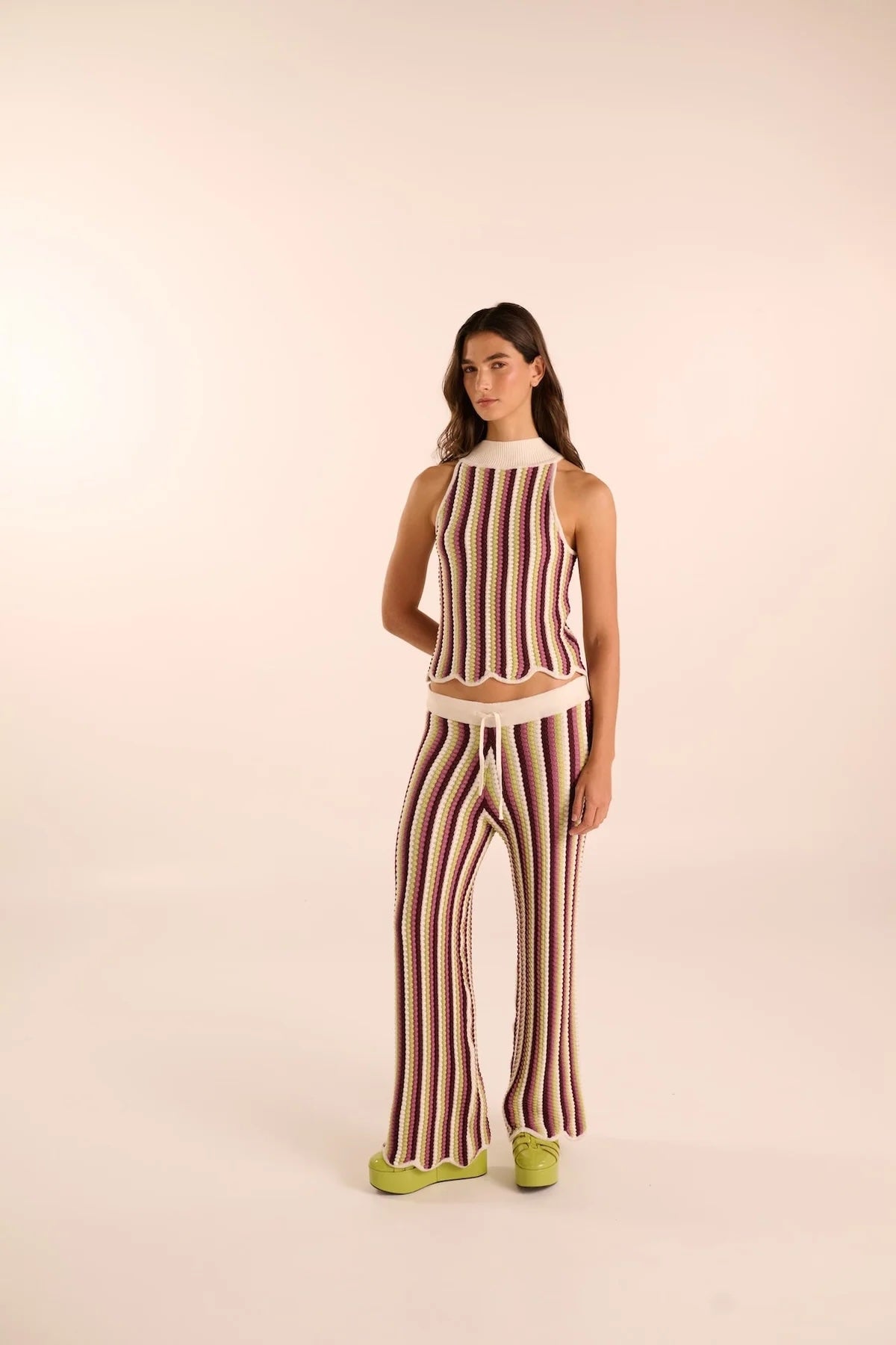 Woman wearing a hand-knit striped set by Vorn. Available at EVAMAIA boutque.
