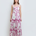 model wearing the Audrey Maxi Dress by Mar de Lua Swimwear. She's standing in front of a white background. The purpose of this image is to highlight the dress because it's available at EVAMAIA boutique in Studio City, CA.
