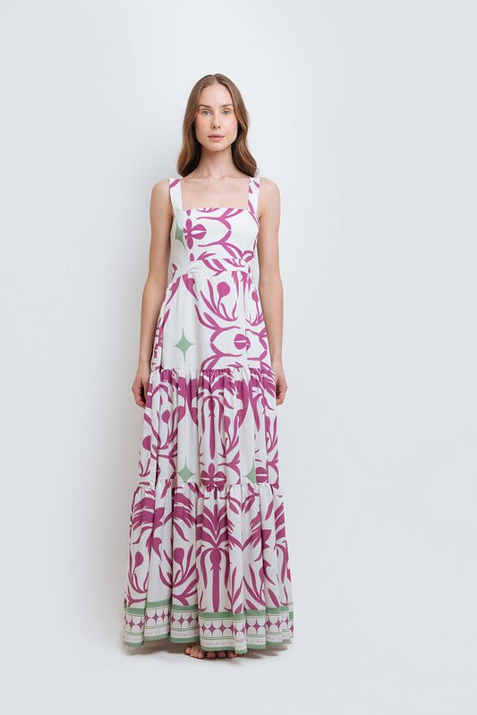 model wearing the Audrey Maxi Dress by Mar de Lua Swimwear. She's standing in front of a white background. The purpose of this image is to highlight the dress because it's available at EVAMAIA boutique in Studio City, CA.