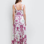 model wearing the Audrey Maxi Dress by Mar de Lua Swimwear. She's standing in front of a white background. The purpose of this image is to highlight the dress because it's available at EVAMAIA boutique in Studio City, CA.