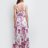 model wearing the Audrey Maxi Dress by Mar de Lua Swimwear. She's standing in front of a white background. The purpose of this image is to highlight the dress because it's available at EVAMAIA boutique in Studio City, CA.
