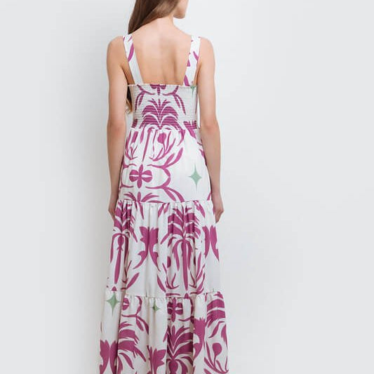 model wearing the Audrey Maxi Dress by Mar de Lua Swimwear. She's standing in front of a white background. The purpose of this image is to highlight the dress because it's available at EVAMAIA boutique in Studio City, CA.