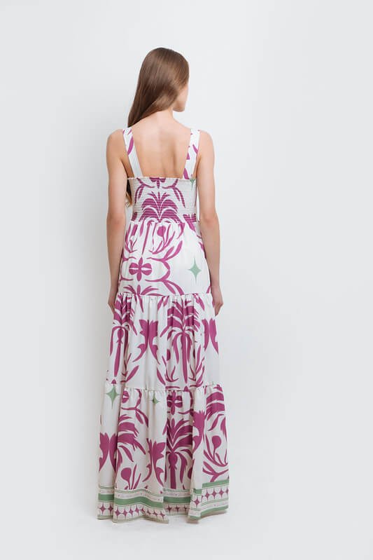 model wearing the Audrey Maxi Dress by Mar de Lua Swimwear. She's standing in front of a white background. The purpose of this image is to highlight the dress because it's available at EVAMAIA boutique in Studio City, CA.