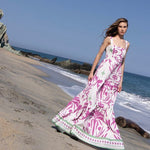 model wearing the Audrey Maxi Dress by Mar de Lua Swimwear. She's standing at the beach. The purpose of this image is to highlight the dress because it's available at EVAMAIA boutique in Studio City, CA.