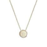 image of a cord necklace with a sun charm. it's against a white background. the purpose of this image is to highlight the necklace by Pajarolimon jewelry because it's for sale at EVAMAIA Boutique in Studio City, CA.