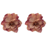 Pair of pink flower-shaped earrings on a white background